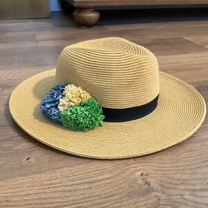 Sun ‘N Sand hat with black band and blue green & natural raffia flower detail